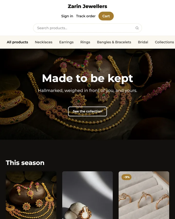 Zarin Jewellers: a dark gold storefront, a full-width photograph of hallmarked gold, and a row of necklaces and rings priced beneath it.